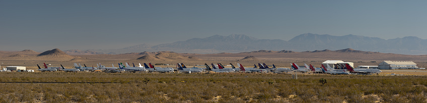 Mojave, CA/USA: panoramic image of the Mojave Air and Space Port showing commercial airplanes bound to storage or recycling.