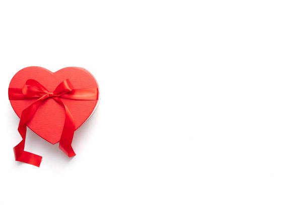 Gift box and red ribbon isolated over white