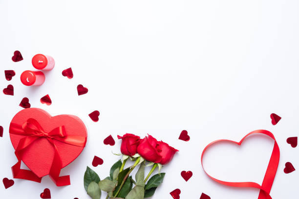 Valentine's day background with heart shape decorations, gift and ribbons. View from above. Flat lay composition
