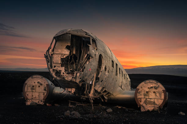 istock Crushed plane Dakota on black beach at the sunset. 1185281921