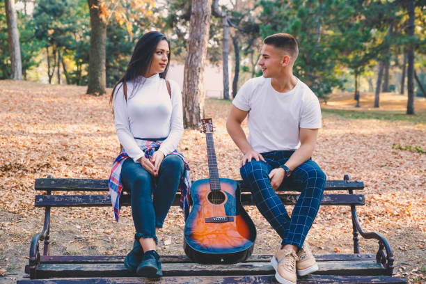 istock Couple in the autumn park 1185284289