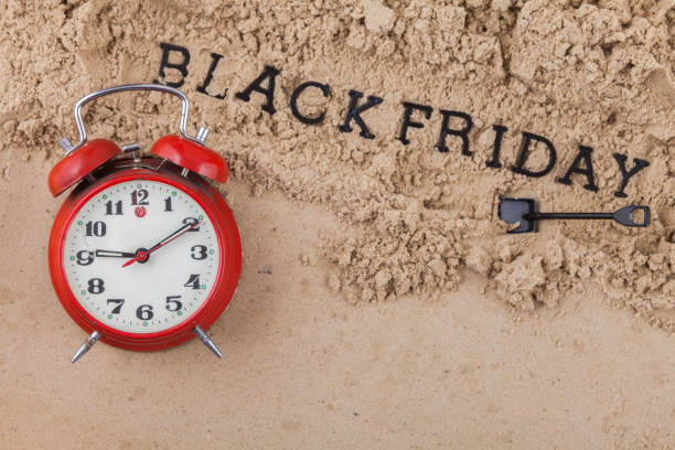 Concept outdoor text black friday on wet sand