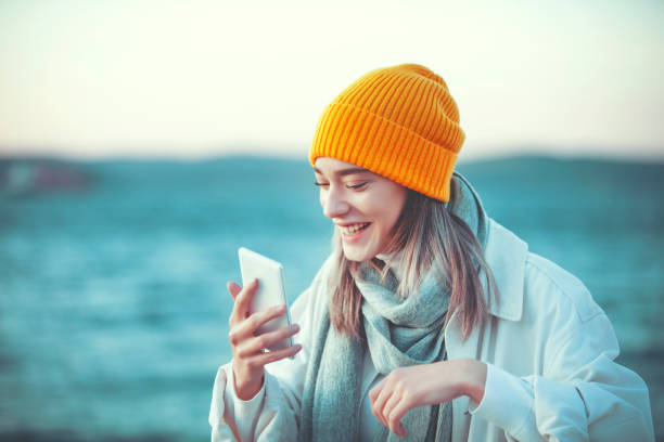 istock Beautiful young woman using a phone and making a video call 1185287311