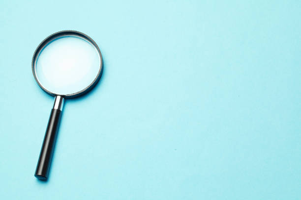 istock Magnifying glass. Search tool. Green background. 1185289104