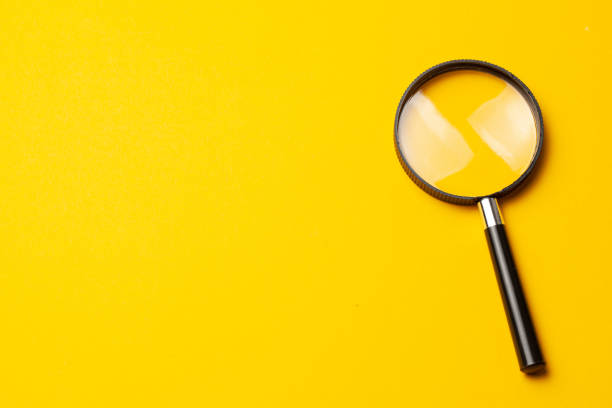 istock Magnifying glass. Search tool. Yellow background. 1185289169