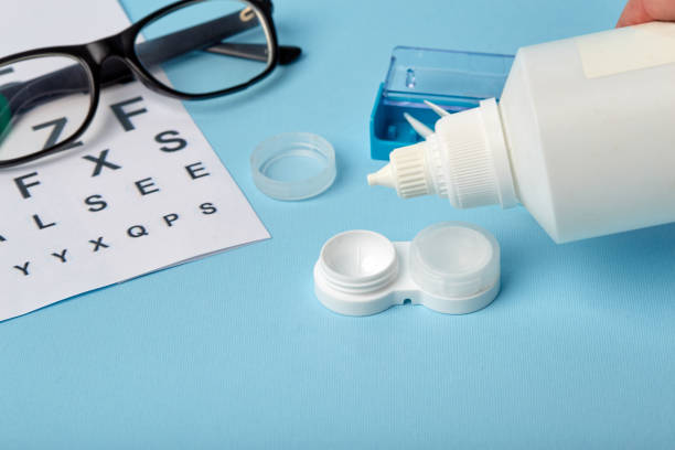 istock Flat composition with contact lenses, table for eye examination. Accessories for ophthalmologists. Glasses and lenses for vision correction on a blue background 1185290928