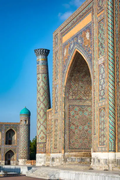Detail of the portal (iwan) of Sher-Dor Madrasah (Madressa) at Registan Square in the city of Samarkand. The Madressa was built in the early 17th century. The full ensemble of the Registan Square is listed as UNESCO World Heritage Site. Samarkand was one of the most important oasis and place of caravanserais at the Great Silk Road.