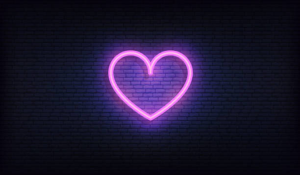 istock Heart neon sign. Glowing bright purple heart signboard 1185295923