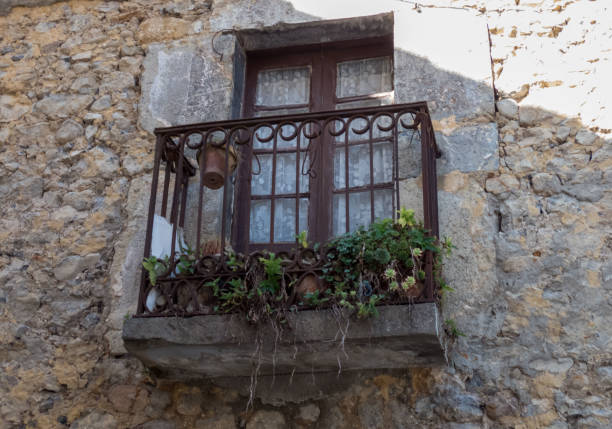 An Old Window with balcony On an old Stone House in Cantabria, Spain