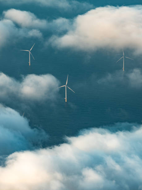 istock Row of wind turbines at sea 1185298055