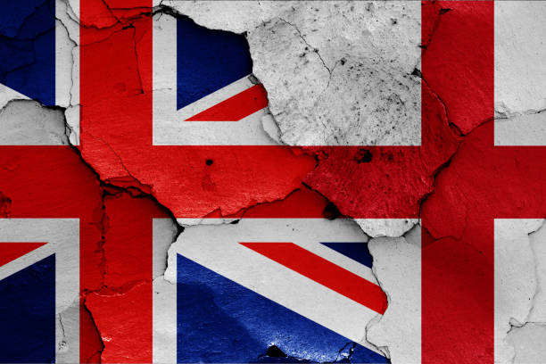 istock flags of UK and England painted on cracked wall 1185298593