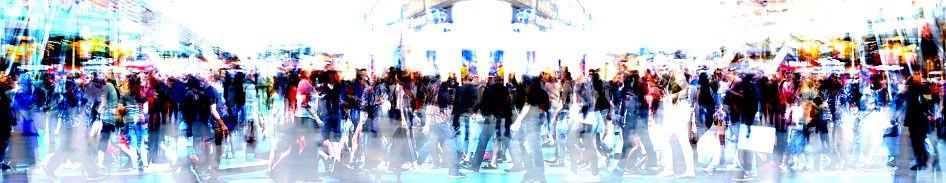 Walking people blur. Lots of people walking in the City of London. Wide panoramic view of people crossing the road, multiple exposure image.