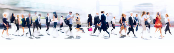 walking people blur. lots of people walking in the city of london. wide panoramic view of people crossing the road. - crossing people panoramic road imagens e fotografias de stock