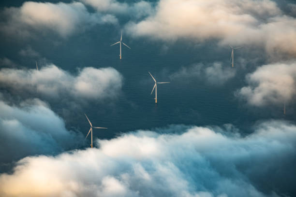 Wind turbines at sea stock photo