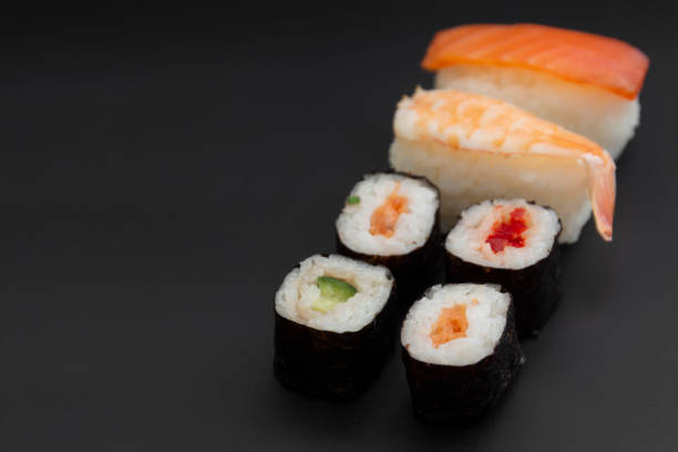 istock Japanese seafood sushi set on black background isolated, copy space 1185300075