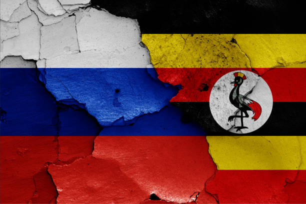 istock flags of Russia and Uganda painted on cracked wall 1185300562
