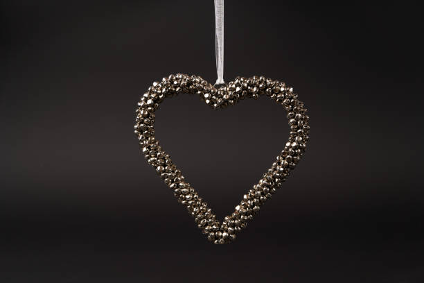 istock Heart, Christmas tree toy on dark background with copy space 1185305921