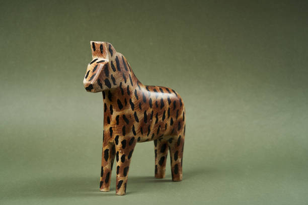 istock Wood horse toy on green background with copy space 1185307100