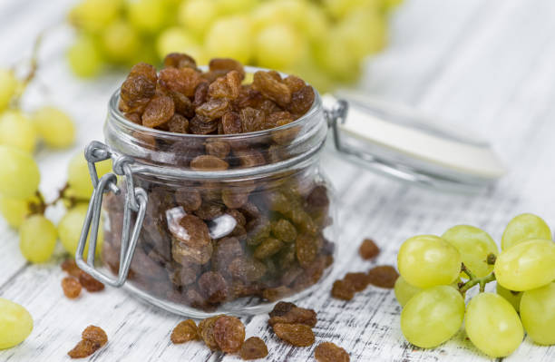 Portion of Raisins as detailed close-up shot; selective focus