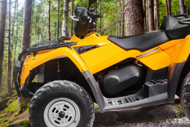 istock Yellow offroad touring atv vehicle standing in forest. 1185309822