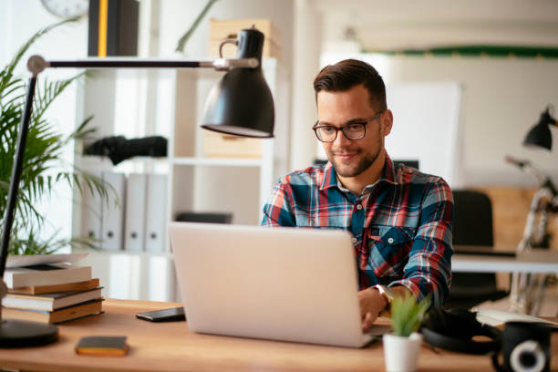 istock Man using laptop in his office. stock photo 1185311105