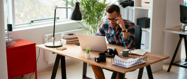 istock Man using laptop in his office. stock photo 1185311132