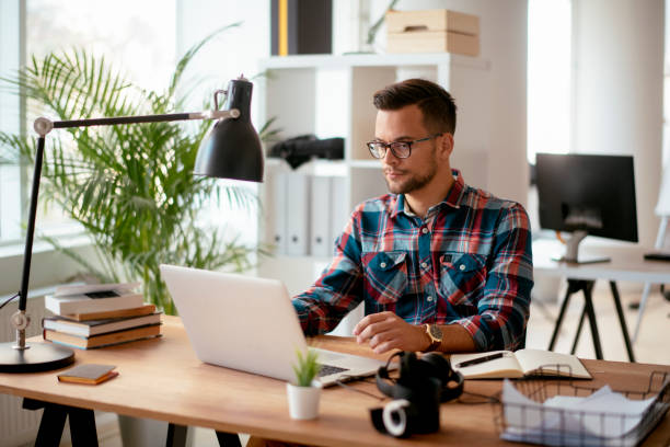 istock Man using laptop in his office. stock photo 1185311926