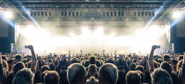 istock Filming concert on smart phone 1185315498