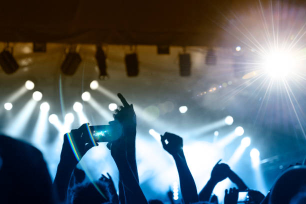 istock Filming concert on smart phone 1185315502