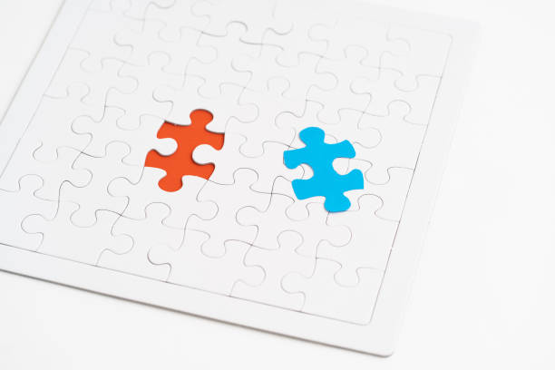 istock Blue jigsaw piece and red hold jigsaw 1185315850