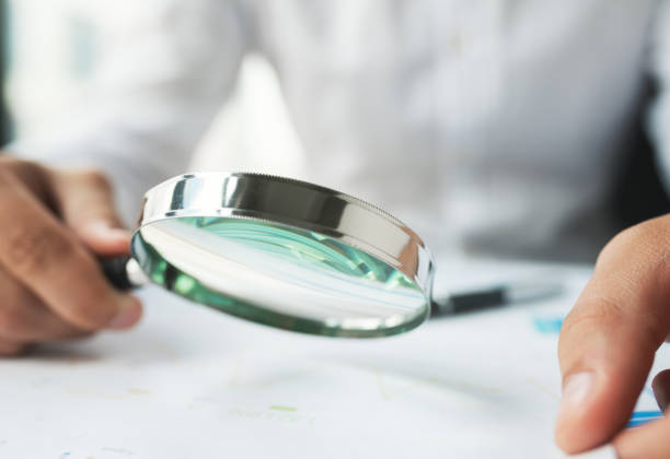 istock Businessman Reading Contract Details Before Signing 1185316459