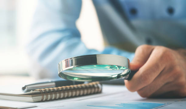 istock Businessman Reading Contract Details Before Signing 1185316469