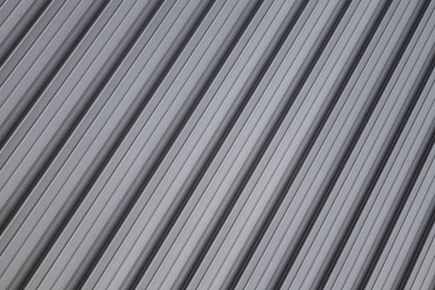 istock Angle view at gray corrugated metal wall or fence surface. 1185316720