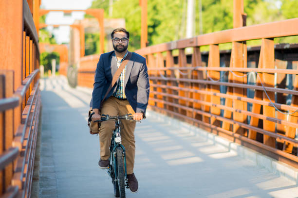 istock Biking Businessman 1185317006