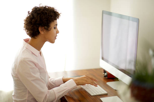 istock young woman working with computer in office 1185317072