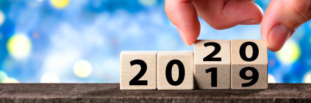 istock Hand Changing Date From 2019 To 2020 1185318780