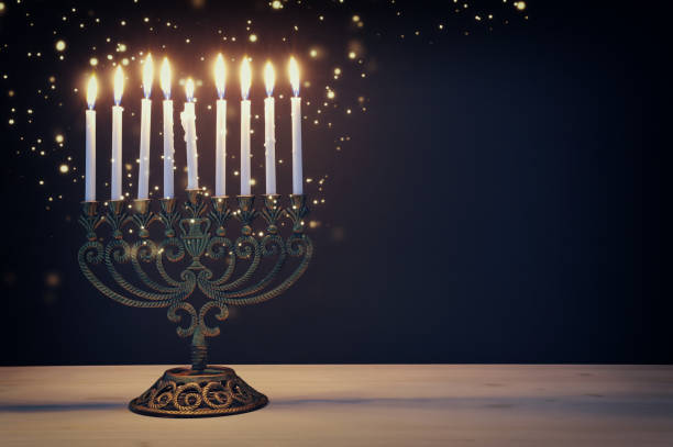 Religion image of jewish holiday Hanukkah background with menorah (traditional candelabra) and candles Religion image of jewish holiday Hanukkah background with menorah (traditional candelabra) and candles hanukkah candles stock pictures, royalty-free photos & images