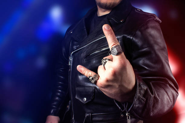 Black leather biker jacket standing on neon lights background.