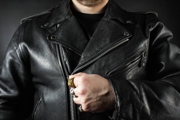 istock Man in black leather biker jacket and rings closeup. 1185321627