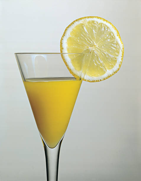istock Cocktail glass with juice and lemon 118532288
