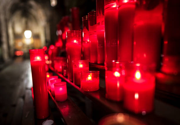 istock red glowing burning candles at a Cathedral in Spain 1185323619