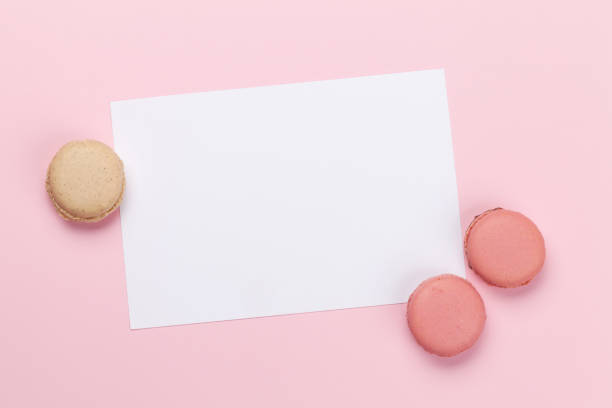 istock Greeting card with macaroon sweets holiday template 1185324207
