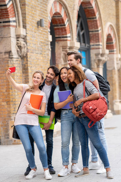 istock Happy group of students taking a selfie 1185326246