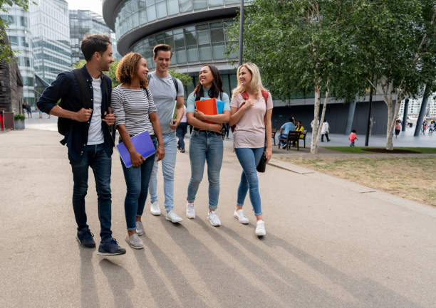 Diverse group of students walking on the street