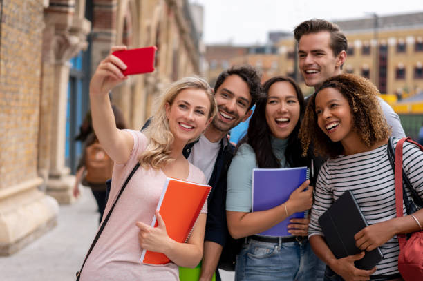 istock Happy group of students taking a selfie 1185326271