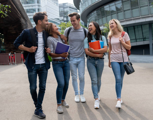 istock Happy group of students having fun outdoors 1185326272