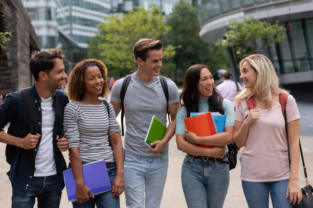 istock Happy group of students talking outdoors 1185326277