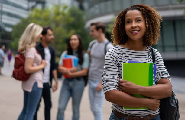 istock Thoughtful student smiling outdoors 1185326299