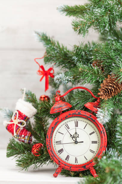 istock Christmas card with decorated fir tree and clock 1185327440