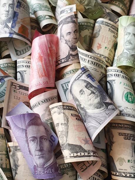 istock Chilean banknotes and American dollar money 1185328631